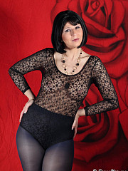 Leggy MILF Desyra teasing in dark blue image 1